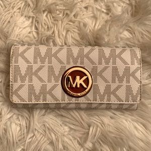 Michael Kors wallet in white with MK pattern